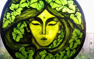 green lady stained glass roundel