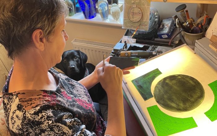 stained glass artist christine at work